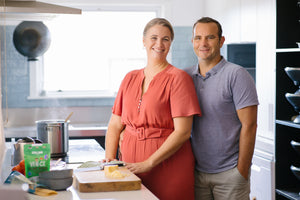 Adult couple in kitchen cooking recipes with mince